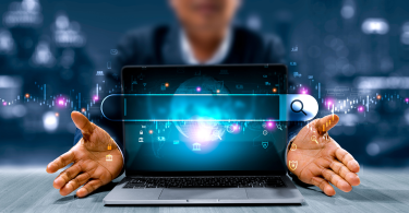 Hands-opening-laptop-search-bar